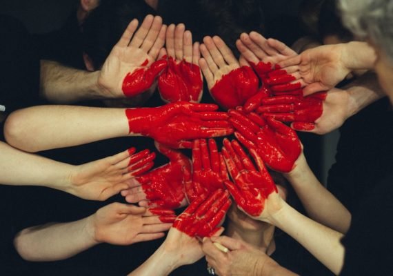 Many hands coming together to make a heart, symbolic of the gift of whole body donation