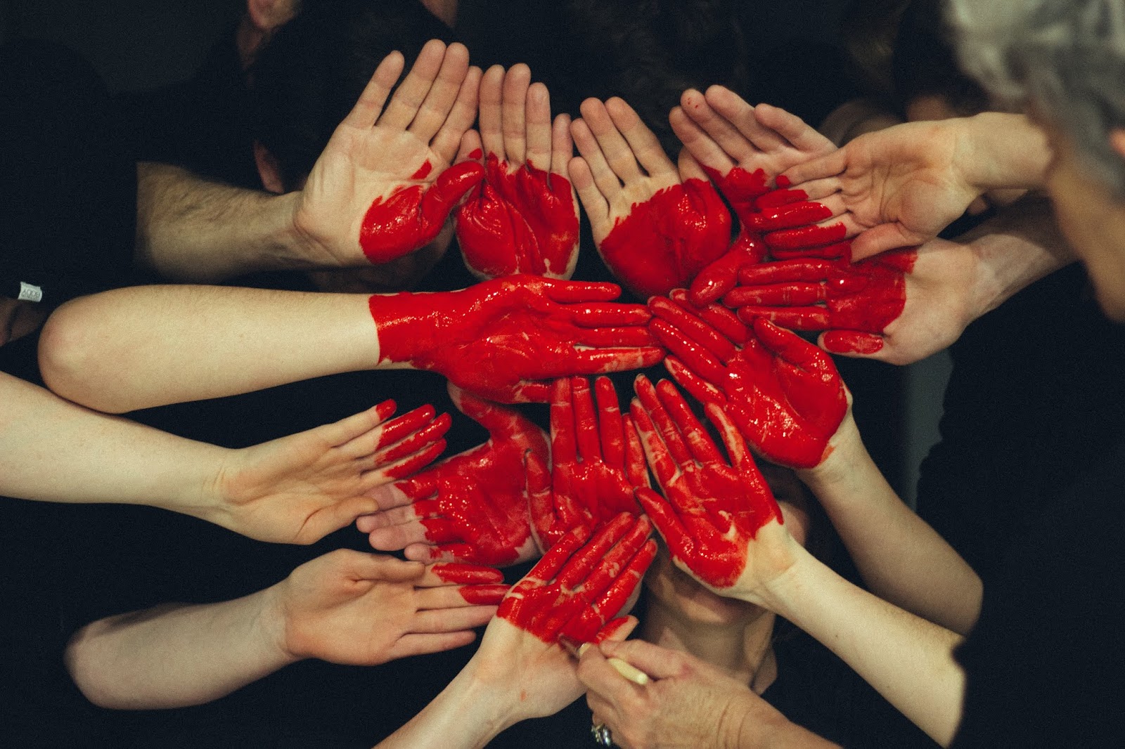 Many hands coming together to make a heart, symbolic of the gift of whole body donation